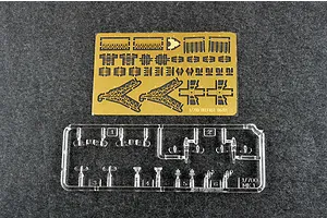 A photo-etched brass fret and a clear plastic sprue for a 1/700 scale model kit of HMS Belfast.