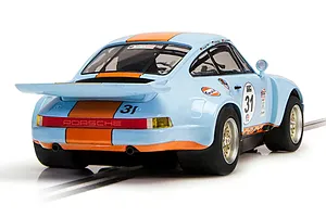 Rear three-quarter view of a light blue and orange Scalextric Porsche 911 Carrera RSR 3.0 Gulf Edition slot car on a track.