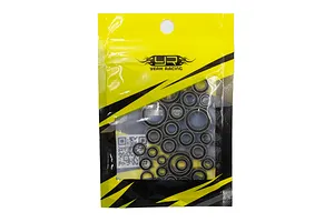 A sealed yellow and black plastic bag containing a set of various sized metal ball bearings for an RC car.