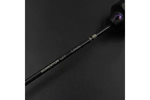 Close-up of a Yeah Racing Momentum 1.5mm hex driver shaft with black finish and laser-etched branding against a dark background.
