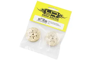 A pair of Yeah Racing brass wheel hex weights in their original yellow and clear plastic retail packaging.