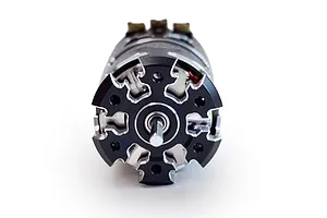 Front view of a Team Powers Actinium V5 sensored brushless motor showing the black and silver machined end bell and output shaft.