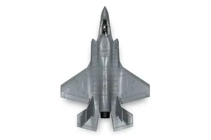 Top-down view of an assembled grey plastic model of a Lockheed Martin F-35B Lightning II fighter jet.