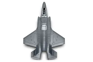 Top-down view of a grey Lockheed Martin F-35B Lightning II plastic model aircraft on a white background.