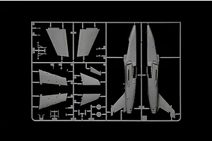 A grey plastic sprue containing parts for an AMX Ghibli model aircraft, including fuselage halves and wing sections, set against a black background.