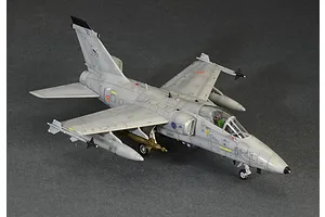 A high-angle view of a completed 1/72 scale Italeri AMX Ghibli model aircraft, painted in grey with Italian Air Force markings on a dark grey background.