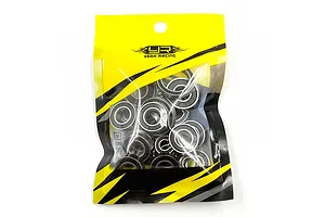 A sealed plastic bag containing a set of metal ball bearings with black rubber shields, branded with the Yeah Racing logo.