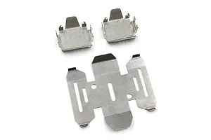 A set of three stainless steel skid plates for an RC vehicle, featuring one large plate and two smaller matching plates.