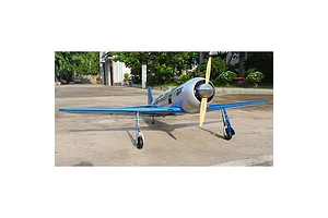 Front view of a Seagull RC Reno Yak 11 model plane in blue and chrome livery, parked on a concrete surface outdoors.