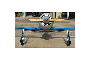 Front view of a Seagull RC Reno Yak 11 model plane in blue and chrome finish, sitting on a concrete surface.