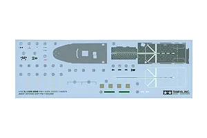 A decal sheet for the Tamiya 1/700 scale JMSDF FFM-1 Mogami model kit, featuring various markings, numbers, and deck patterns on a light blue backing.