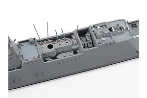A close-up view of the mid-section deck of a 1/700 scale Tamiya JMSDF Mogami-class frigate model kit, showing detailed grey plastic parts.