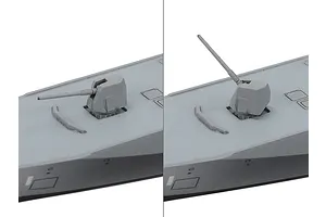 Close-up comparison of a 1/700 scale model ship gun turret in two different elevation positions on a grey deck.