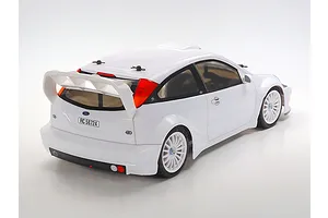 Rear three-quarter view of a white Tamiya 2003 Ford Focus RS RC car model on a plain white background.