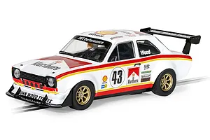 A 1/32 scale Scalextric Ford Escort MK1 RSR slot car in white with red and yellow racing livery, featuring number 43 and Marlboro branding.