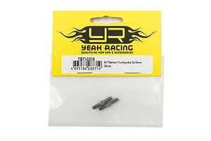 Two Yeah Racing 64 Titanium 3x18mm turnbuckles in their original yellow and black retail packaging.