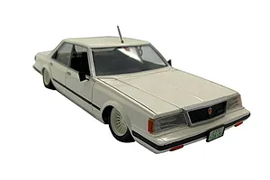 A white Fujimi 1/24 scale Toyota Mark-II GT Grande plastic model car, shown from a high-angle front three-quarter view.