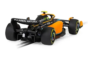 Rear three-quarter view of a Scalextric 1/32 scale McLaren MCL36 Formula 1 slot car in orange and black livery on a white background.