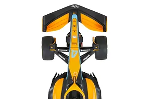 Top-down view of a Scalextric 1/32 scale McLaren MCL36 Formula 1 slot car in orange, black, and light blue livery.