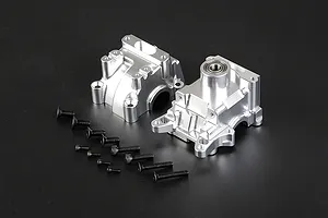 Two silver aluminium RC gearbox case halves with a set of black mounting screws on a dark background.
