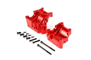 Two red anodized aluminium gearbox case halves for an RC car, accompanied by a set of black mounting screws on a white background.