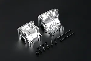 Two silver aluminium gearbox case halves and a set of black mounting screws on a dark background.