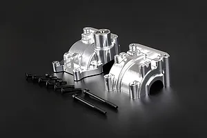 Rovan silver aluminium gearbox case set for RC cars with included black mounting screws on a black background.