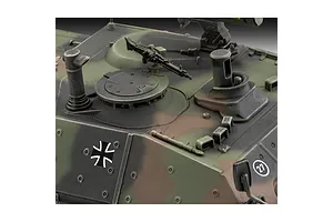 Close-up of the top deck of a camouflaged Raketenjagdpanzer Jaguar 1 model tank showing the hatch, machine gun, and German military markings.