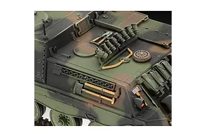 Close-up of a 1/35 scale Revell Raketenjagdpanzer Jaguar 1 model tank showing detailed camouflage paint, tools, and equipment on the hull.