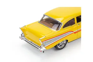 A high-angle rear view of a yellow 1957 Chevrolet Bel Air scale model car with chrome trim and red side decals on a white background.