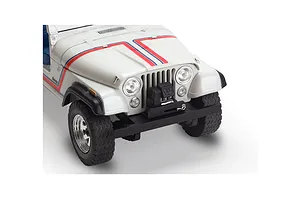 Close-up of the front end of a white 1977 Jeep CJ-7 plastic model kit featuring red and blue hood stripes and a black front bumper with a winch.
