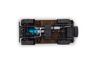 Top-down view of the chassis and undercarriage of a 1/24 scale model Jeep CJ-7, showing the brown frame, blue engine block, and black drivetrain components.