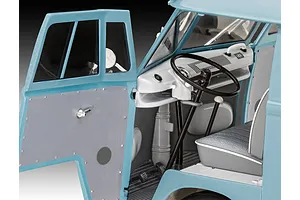 Close-up of the interior of a 1/24 scale Revell Volkswagen T1 Gulf model van, showing the dashboard, steering wheel, and open driver-side door.