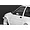 A close-up view of a white 1/10 scale RC car body shell featuring a black side door mirror mounted on the driver side door.