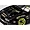 Close-up of a black RC drift car body with gold decals, custom vented hood, and gold rims on a light surface.