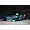 Custom painted green metallic RC drift car body shell mounted on a chassis with deep dish wheels against a dark background.