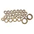 A collection of various sized bronze-coloured metal bushings arranged on a white background.