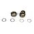 Two TLR aluminium rear gearbox bearing inserts and four thin metal shims arranged on a white background.