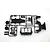 A black plastic parts tree for a Tamiya RC model containing various chassis components like shock towers and skid plates.