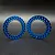 Two blue anodized aluminum 1.9 inch beadlock rings for RC crawler wheels, shown against a dark background.