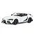 A studio shot of a white Tamiya 1/24 scale Toyota GR Supra model car with black wheels and carbon fiber style trim.