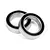 Two metal ball bearings with black rubber seals resting on a white background.