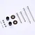 A set of FMS RC differential spare parts including metal drive shafts, small gears, and plastic components on a white background.