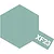 A hexagonal swatch of Tamiya XF-23 Light Blue paint with the code XF23 printed in white on a small tab extending from the bottom right.