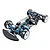 A high-angle studio shot of a Tamiya TRF421X 1/10 scale 4WD RC touring car chassis, featuring blue anodized aluminum parts and carbon fiber components.