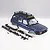 FMS 1/10 Toyota Land Cruiser LC80 blue painted RC body shell with roof rack, snorkel, and various black plastic bumper and mounting accessories.