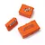 Three orange miniature storage boxes of varying sizes with decals, isolated on a white background.