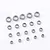 A collection of various sized metal ball bearings arranged on a plain white background.