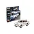 Revell 1/24 scale Trabant 601S model car kit, featuring a white car with peace-themed decals next to its retail packaging box.
