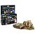 Revell 1/76 PzKpfw II Ausf. F model kit box with included paints, glue, and brush, alongside a finished model tank, two soldiers, and a ruined wall diorama.